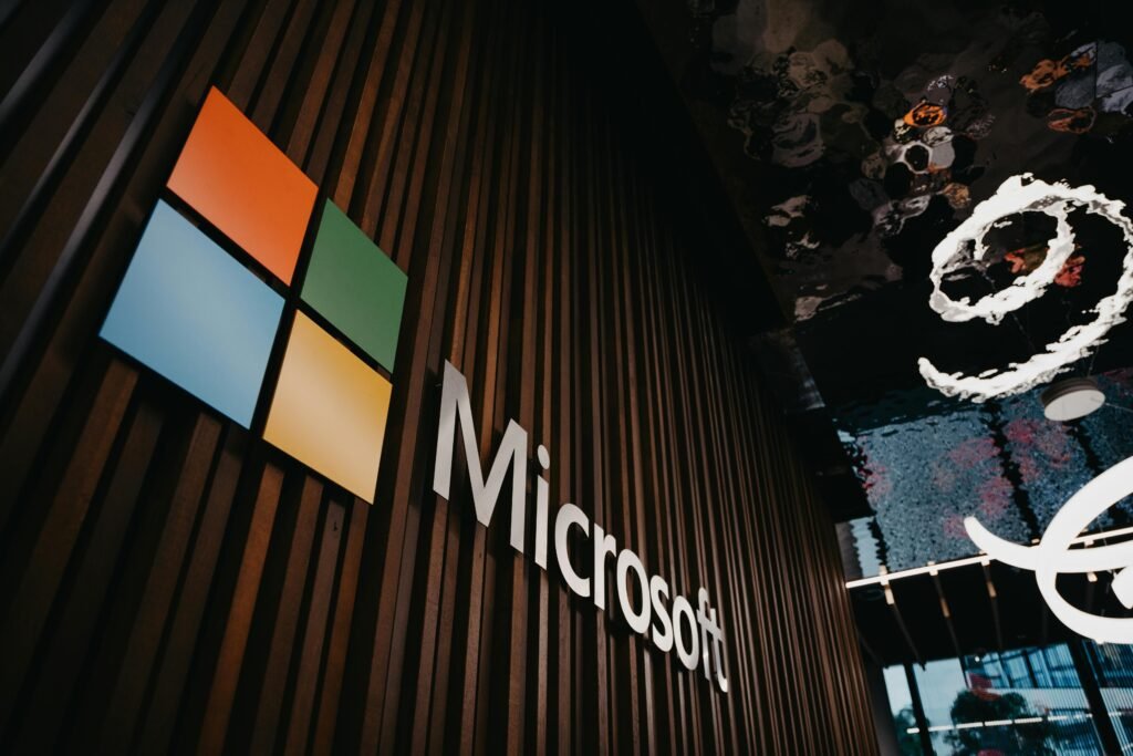 pexels-photo-10142683-10142683 Interior view of Microsoft office with logo on wooden wall in Brussels, Belgium.